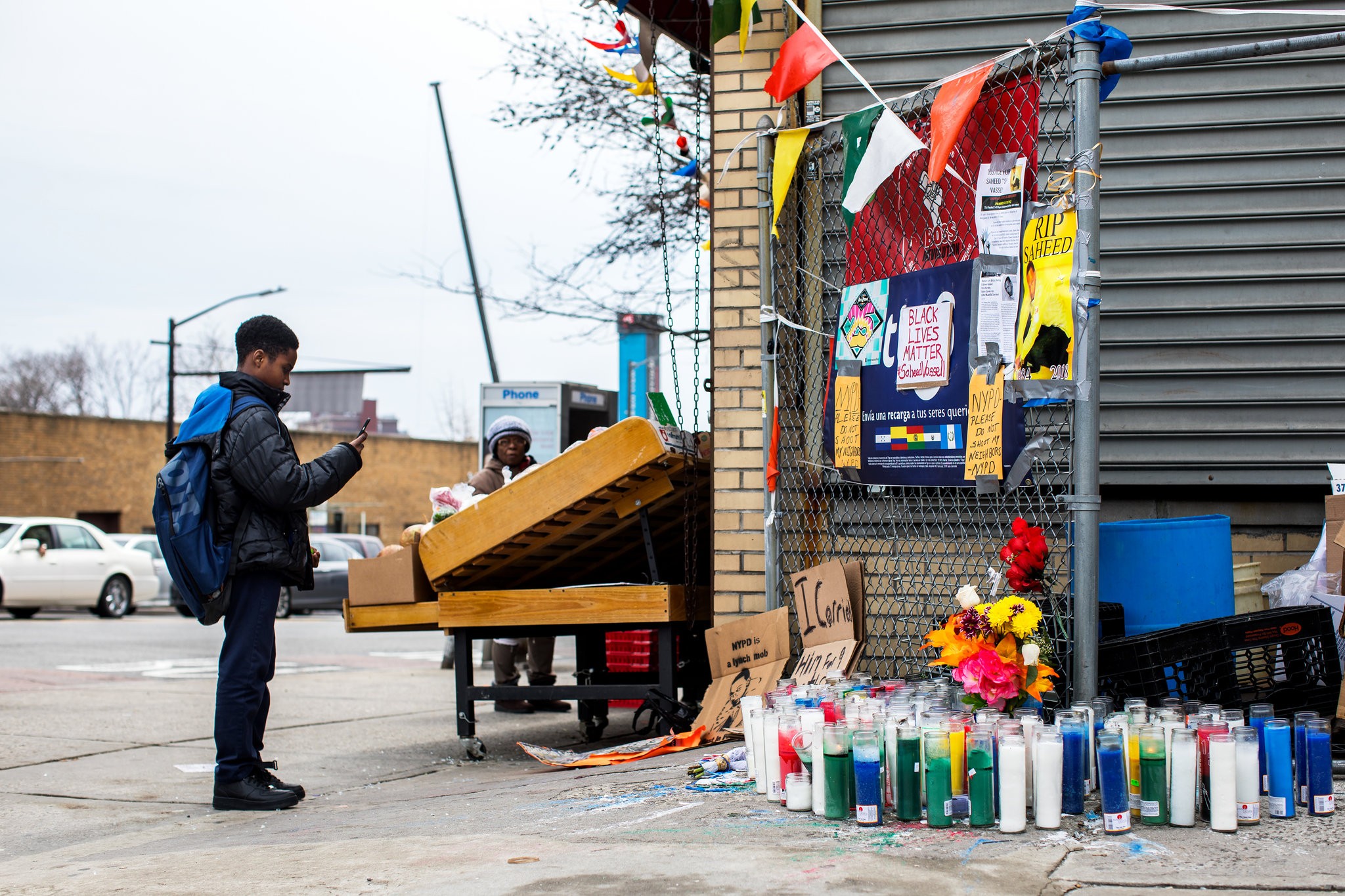 A memorial for Saheed Vassell has grown in Crown Heights, Brooklyn, as residents blame gentrification for his death. Credit Demetrius Freeman for The New York Times